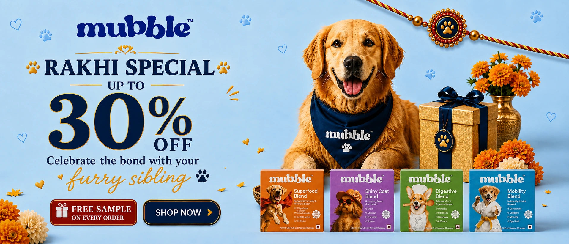 A promotional banner for Mubble pet products featuring a golden retriever wearing a navy bandana with the Mubble logo, next to a wrapped gift box and orange marigold flowers. The left side contains text advertising a 'Rakhi Special up to 30% off' and shows four colorful Mubble dog food pouches at the bottom against a light blue background.